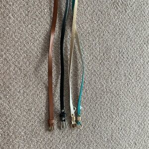 Bundle of 4 thin belts.  Fits small/med wore for high waisted pants/skirts/short